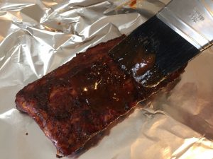 Wet Rub on Baby Back Ribs applied with Brush